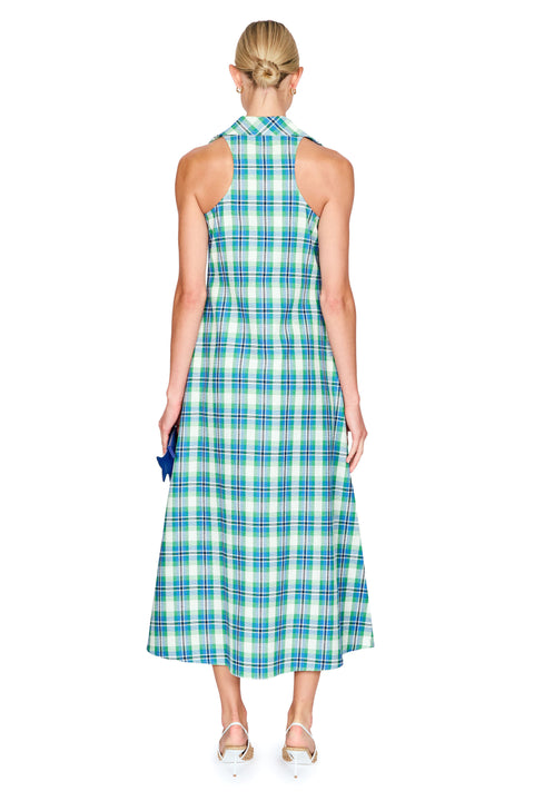 Woman wearing a green and blue plaid dress on a white background back angle