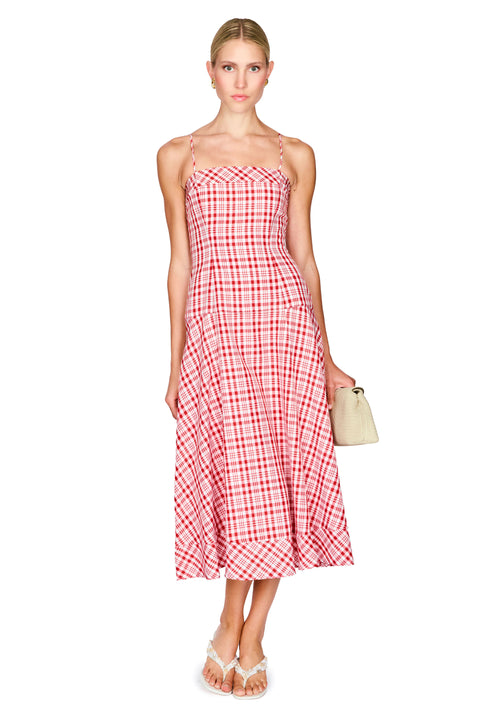 Woman wearing a red and white checkered dress on a white background