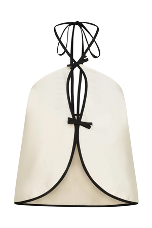 A white taffeta halter top with cutouts and black stitching