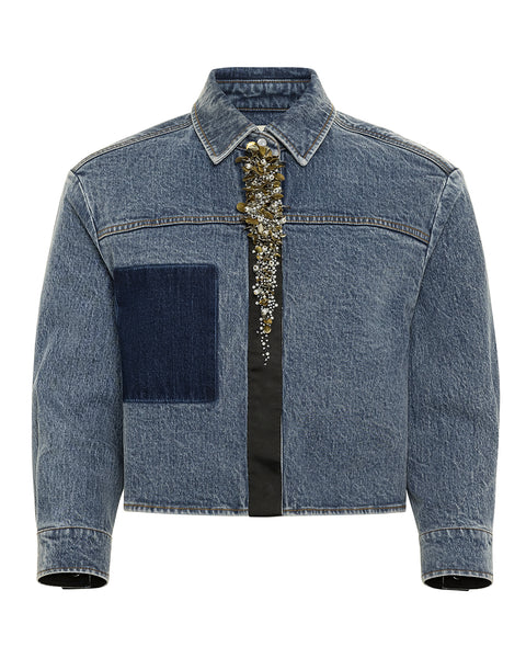 Blue denim jacket with metallic decorative elements on a white background