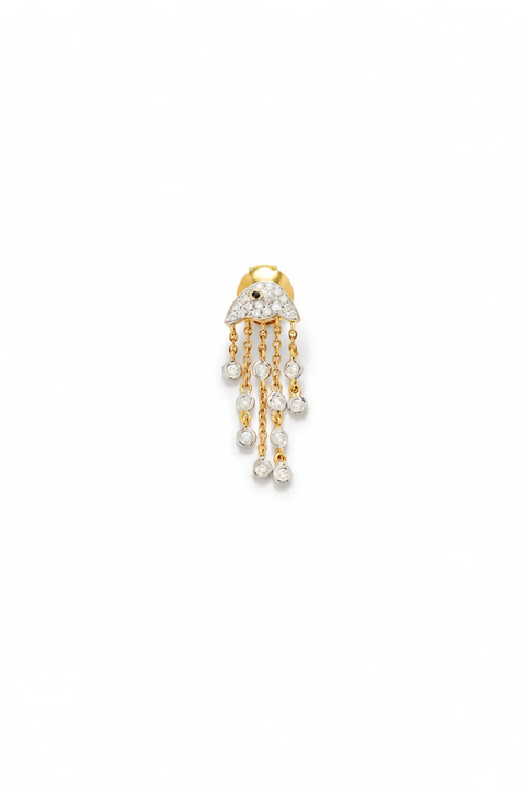 A small gold jellyfish earring with diamond accents