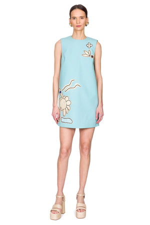 Light blue dress with floral patterns on a white background