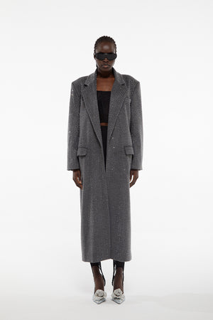 Model facing camera wearing Giuseppe all over rhinestone wool coat