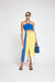 Bright green and blue colorblock midi skirt with front slit on a model