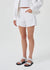 Model wearing the white denim short