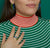 Alternate view of the green and blue earrings on a model